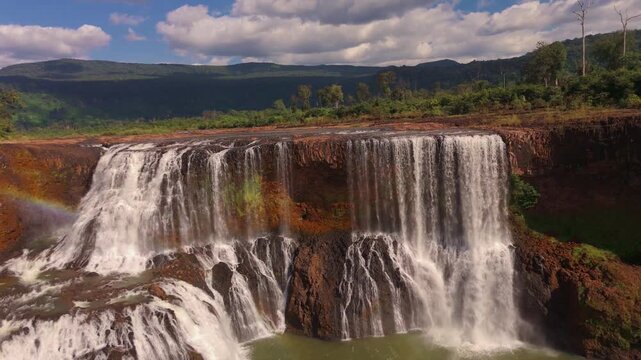Cinematic Aerial Drone Footage Sae Pong Lai Wide Waterfall Cascading Rocky Ledge Jungle River Attapeu Laos