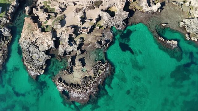 Aerial View of Rocky Coastline and Turquoise Sea at Calette di Torre Cintola on the Adriatic Coast near Monopoli, Bari, Puglia, Southern Italy