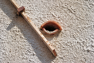 Textured Exterior Wall with Hole and Timber Batten  © eyepals