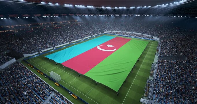Professional Stadium Soccer Game Championship With Flag of Azerbaijan Spread Across the Pitch Before Football Match Start. Cheering Crowds of Fans Surround the Field. Aerial Elevated Static Wide Shot