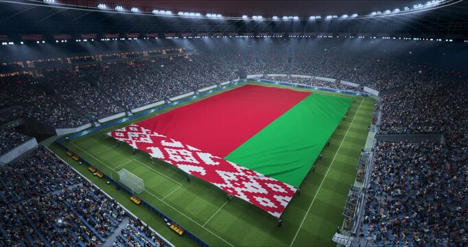 Professional Stadium Soccer Game Championship With Flag of Belarus Spread Across the Pitch Before Football Match Start. Cheering Crowds of Fans Surround the Field. Aerial Elevated Static Wide Shot. 