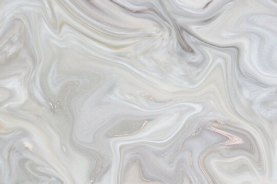 Soft white silk and satin fabric background featuring a wavy liquid texture with silver shine and elegant swirl pattern design textile material