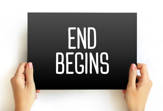 END BEGINS text on card held by person. Paradoxical concept of transition, concluding one chapter to start another. Minimalist studio image on clean background.