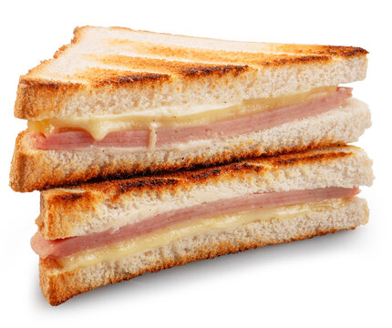 Delicious grilled ham and cheese sandwich cut into triangles and isolated on a white background