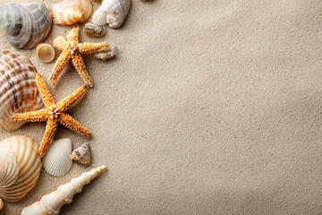 Plakat Sea sand with starfish and shells. Top view with copy space