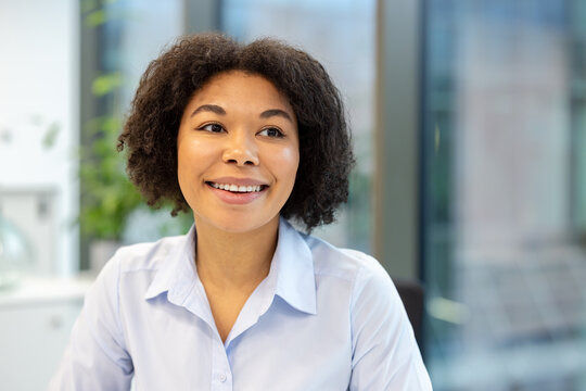 Close-up photo of a happy young African American woman in the office