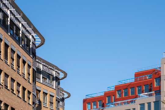 Urban brick architecture building rooftops in Oslo Norway with minimal skyline and open space on clear daylight background and layered city view