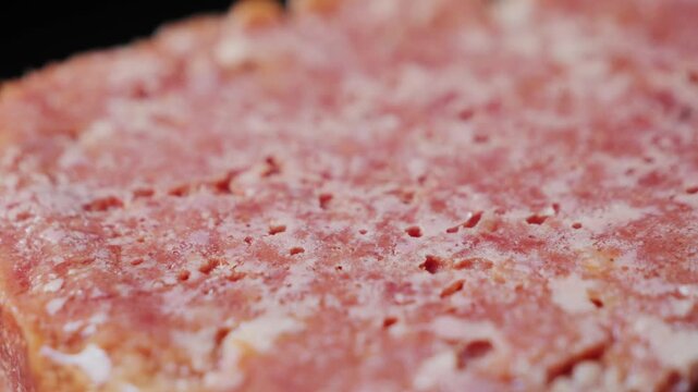 Close-up texture of canned stewed meat, food background for camping, survival and cooking concepts. High quality 4k footage
