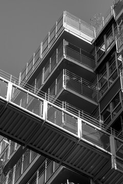 Monochrome modern bridge architecture with steel stairs uses urban lines to build a striking structure where contrast shapes a bold graphic scene