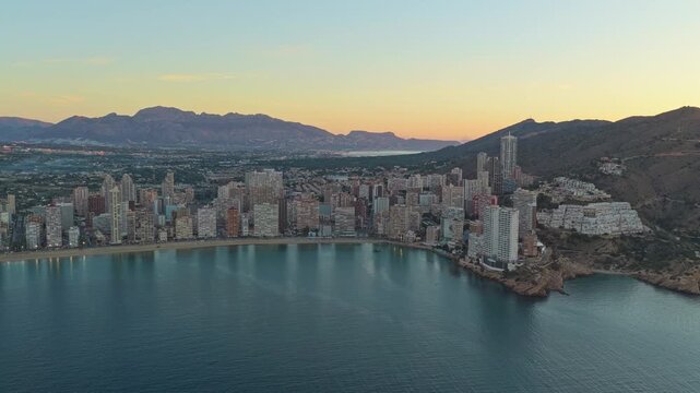 Scenic aerial view of benidorm cityscape at sunset