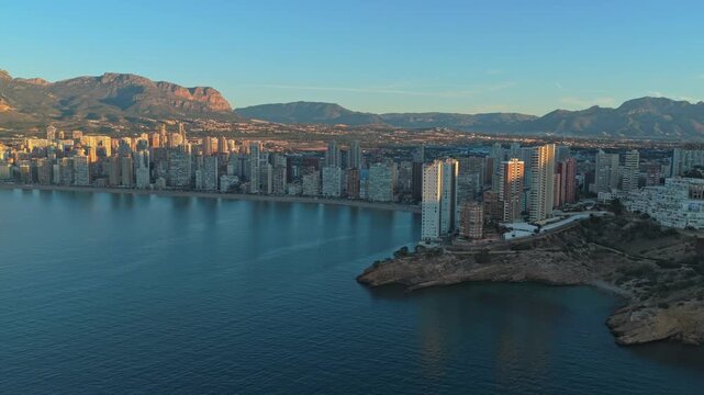 Golden hour over benidorm cityscape and coastline