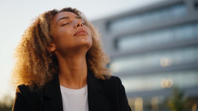 Calm Businesswoman Breathing Deeply Outdoors During Sunset.