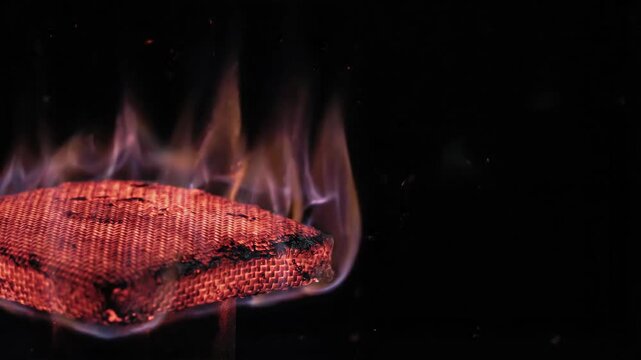 Fire flame burning heat thermal management fabric safety hazard glowing woven heat resistant textile protective charred fabric fire flame heat