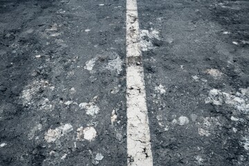 Fototapeta premium Seamless Old Asphalt Road Texture with Faded White Line 8K Weathered Cracked Urban Surface Background Pattern Detail