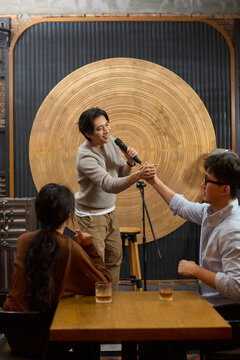 Young professionals let loose and enjoy a night of singing and laughter