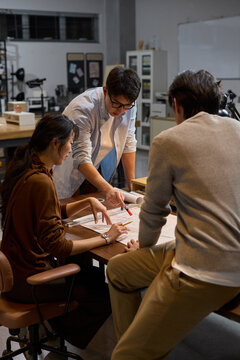 The team works late into the evening to meet a deadline
