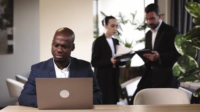 Professionals reviewing business proposal in contemporary office. Concept.
