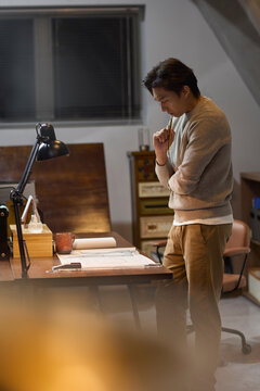 Businessman works late into the evening to meet a deadline