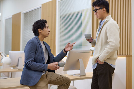 Professionals in discussion at workplace