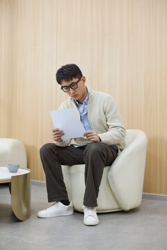 An applicant waits nervously for his interview to start
