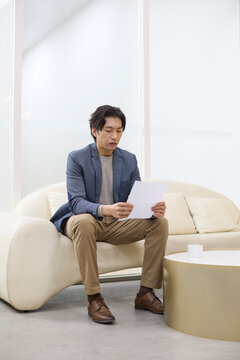 An applicant waits nervously for his interview to start