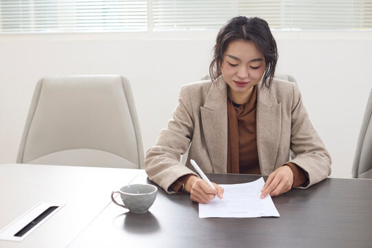 A dedicated employee focuses on work at their office desk