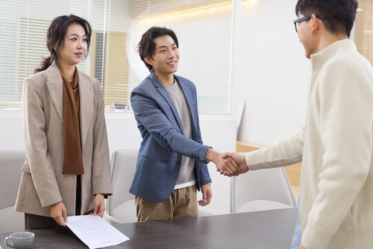 A group of professionals collaborates during a meeting at the office