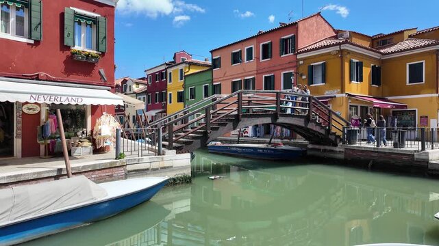 A view of the Ponte San Mauro bridge on the island of Burano, renowned for its colorful buildings, in Venice Italy.