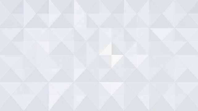 A geometric pattern of white and gray triangles creates a modern and abstract background design for various uses