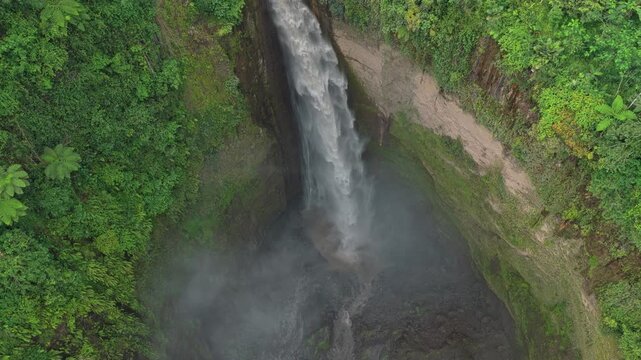 Aerial view of kabut pelangi waterfall in tropical rainforest