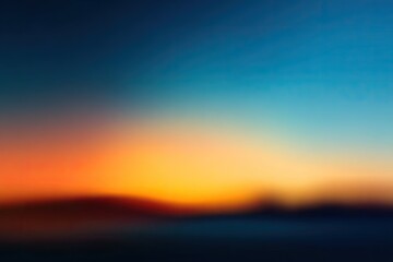 Obraz premium A blurred gradient of warm and cool colors creates a soft, atmospheric effect.