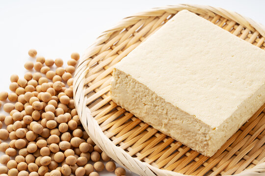 Fresh block of firm Japanese momen tofu (firm bean curd) ready for cooking