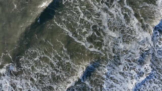 Aerial top-down lace-like wave patterns on sandy beach, Tomioka Fukushima Japan