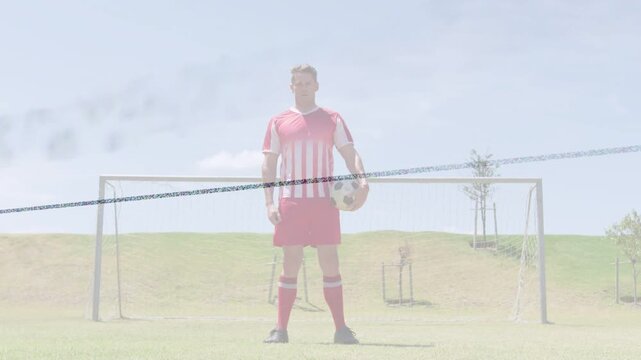 Man soccer player holding ball before goal while faint glitch and haze crossing frame, training