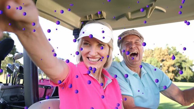 Vertical video: Laughing at camera, woman pointing off-frame in cart pink polo clubs purple overlay