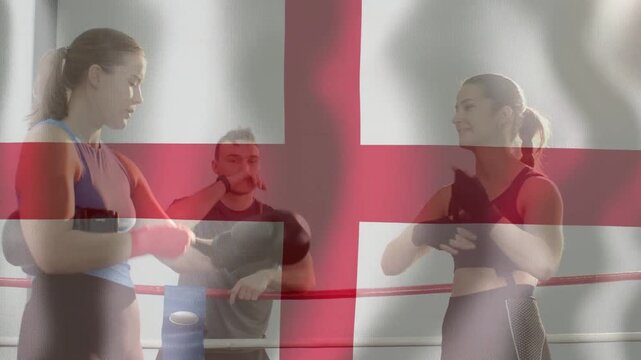 Chat sparking women boxers fixing wraps, checking gloves in ring, flag overlay preparing sparring