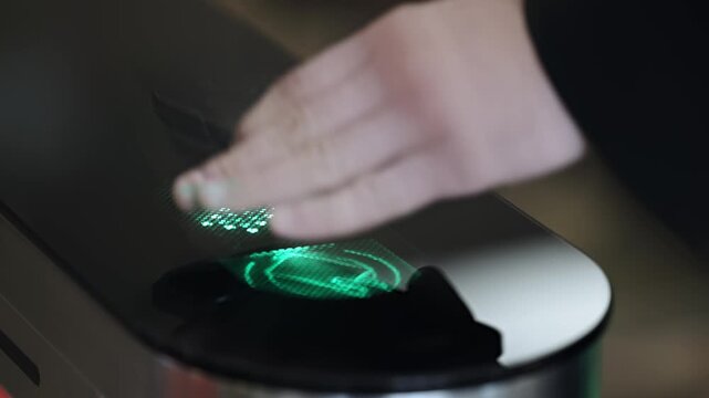 Mobile device enabling secure entry at modern office turnstile. Concept.
