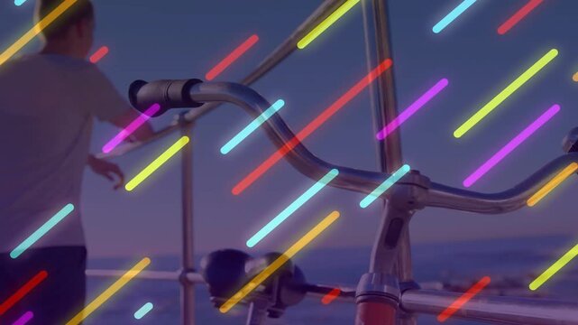 Man walking in from left, leaning on railing, handlebars anchoring travel, neon streak crossing man