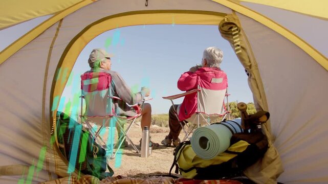 Senior couple sitting in tent, sipping mugs while teal overlay descending showing gear for travel