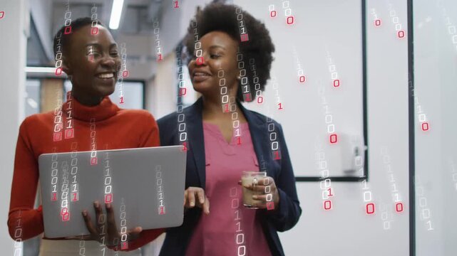 Binary digits appearing, coworkers walking, holding laptop and cup, reviewing data for meeting