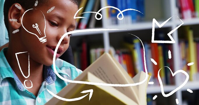 Reading boy in teal checked shirt holding open hardcover book in library, white doodle, copy space