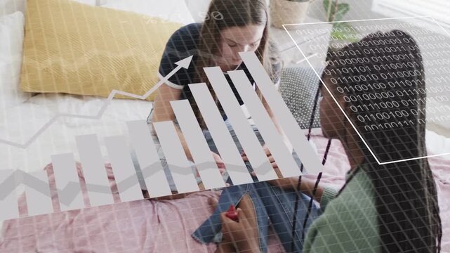 Two teens on bed, one painting toenails red after friend extending foot, AR charts visualizing data