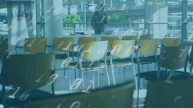 Businessman walking checking phone opening laptop working with binary overlay over man and chairs