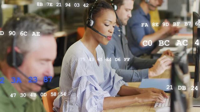 Support agent woman taking call, typing to resolve ticket, hex overlay moving over monitors