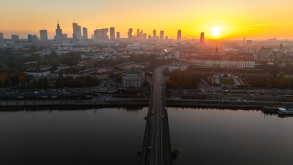 An aerial view of the Vistula River overlooking Warsaw's Old Town in Poland during the autumn sunset © MKavalenkau