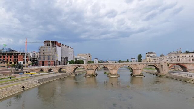 Stone bridge across the Vardar River in Skopje, North Macedonia. Famous landmark in Skopje city center