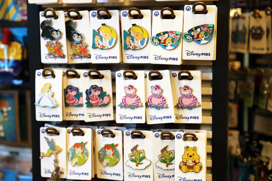 Alice in Wonderland collectible pin set with classic characters for sale in souvenir shops