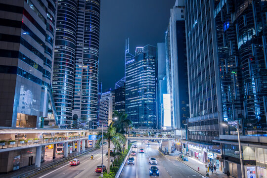 Central, Hong Kong, China, 28 February 2026: night view of financial district with JP Morgan skyscraper, traffic and illuminated modern buildings in dense urban cityscape