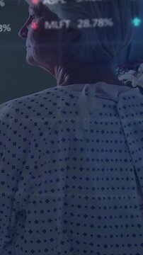 Vertical video: Caregiver placing stethoscope on patient back after hand touch, HUD tracking vitals