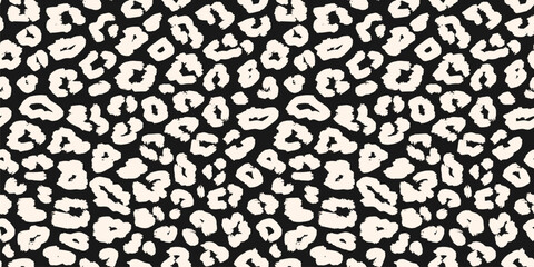 Vector leopard print pattern. Simple black and white seamless background. Animal skin texture of jaguar, leopard, panther, cheetah. Stylish natural repeated design for textile, fabric, print, decor © Olgastocker